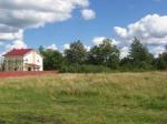 п.Ульяновка,в центре поселка в коттеджной застройке уч-к 24 сотки,ИЖС,собстве нность,ц.водопр., газ,рядом водоём.